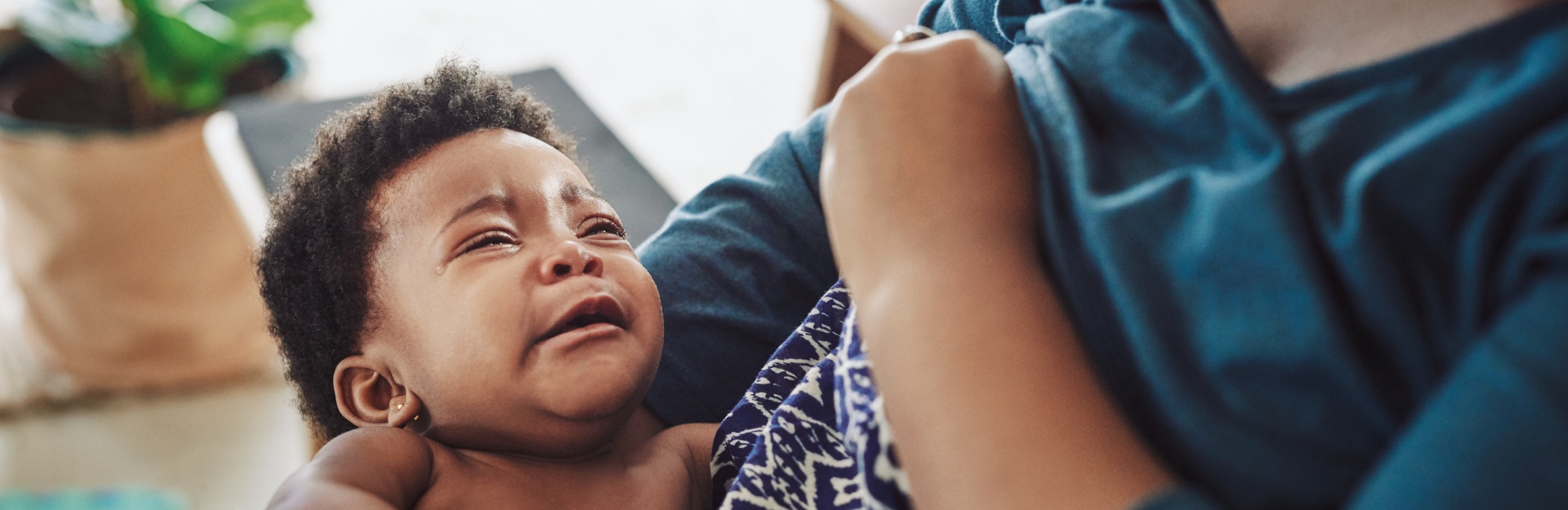 baby cries at breast; conditioned dialling up at breast; breastfeeding; baby cries