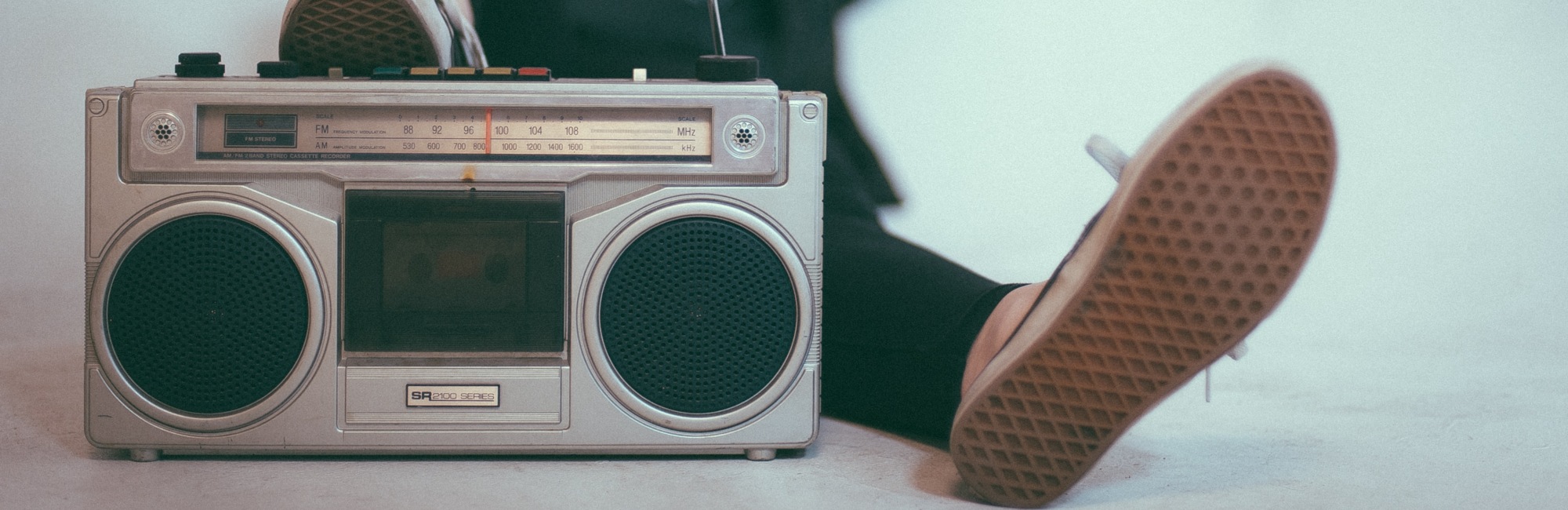 person sitting with portable radio