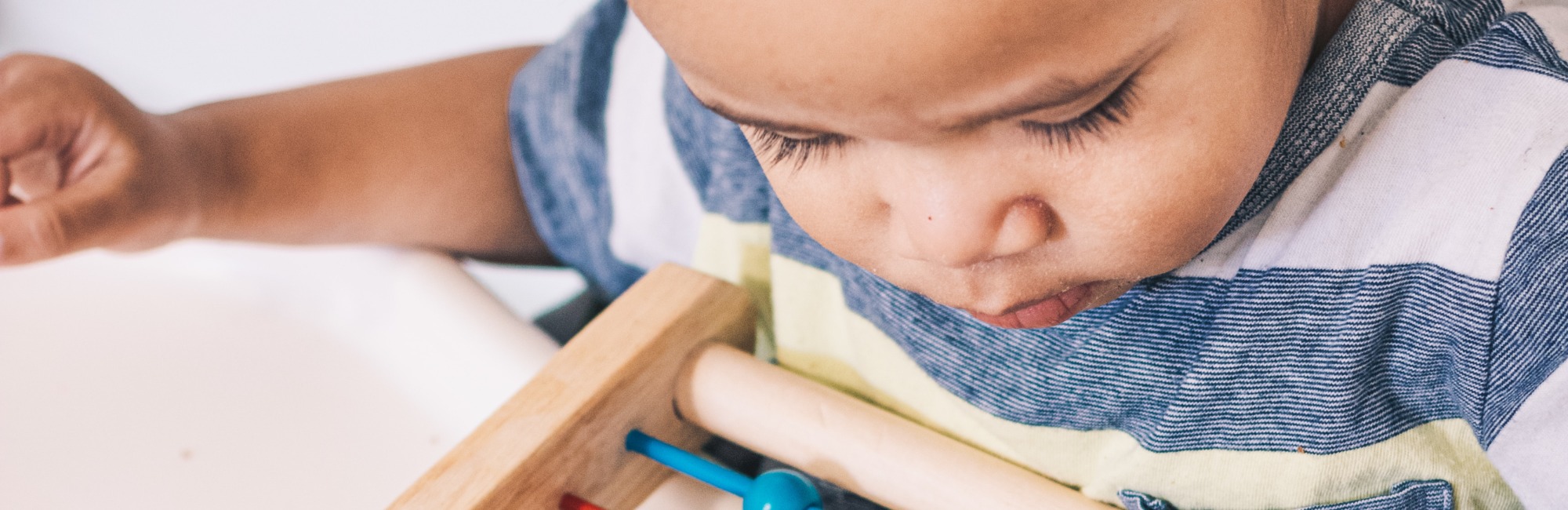 toddler playing with a toy