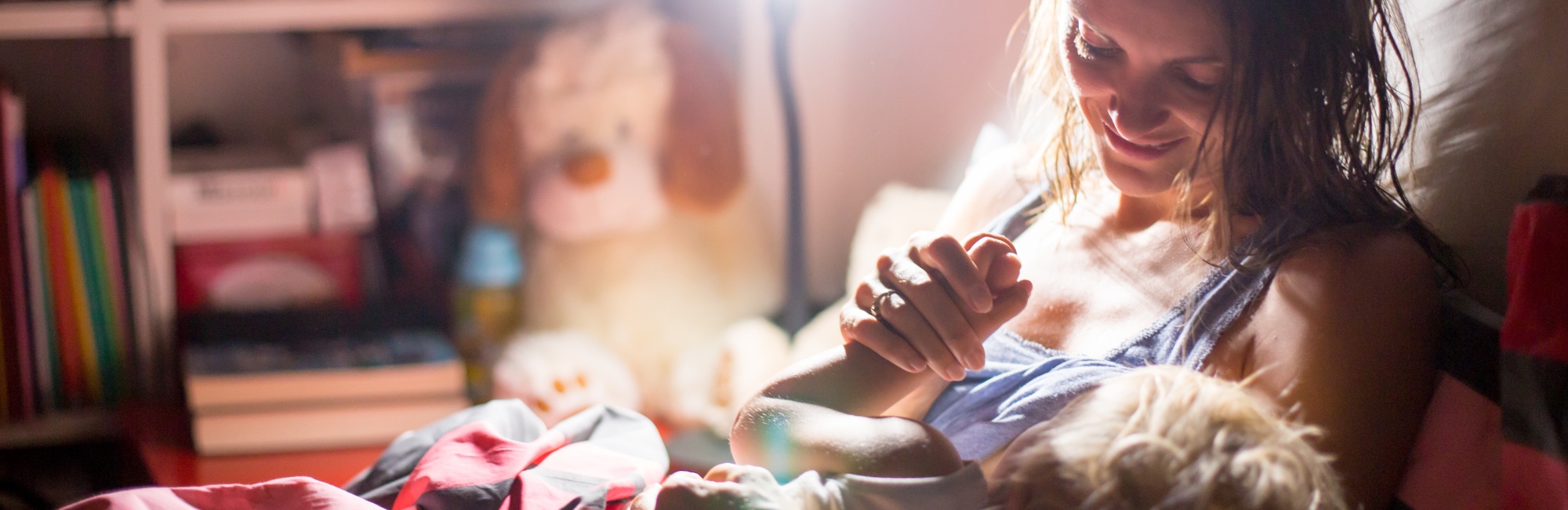 toddler dialling down in mother's lap