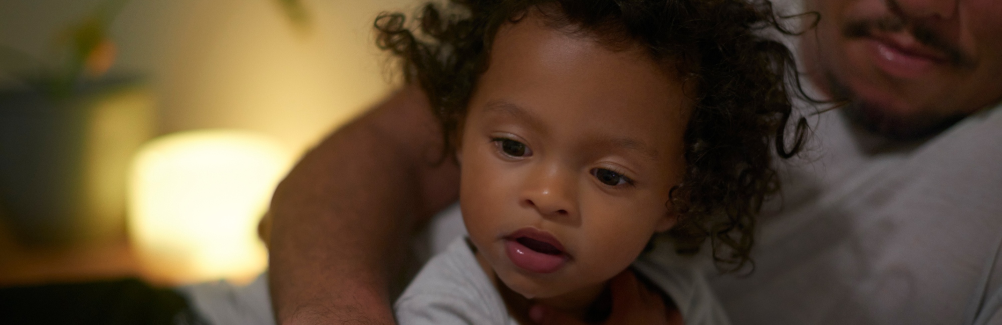 father plays with toddler daughter