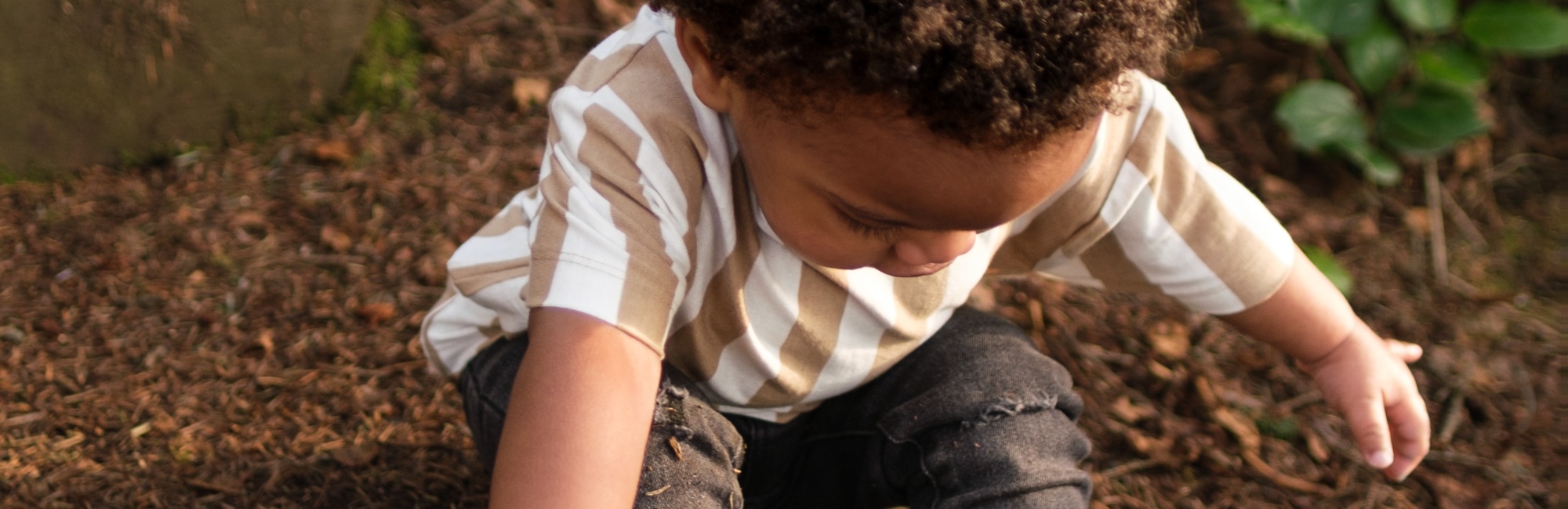 toddler plays outside