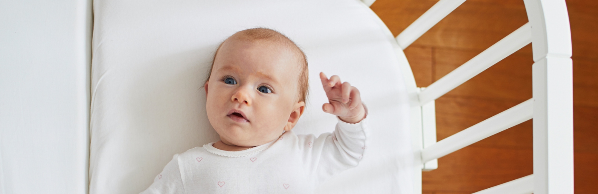 baby alone in cot