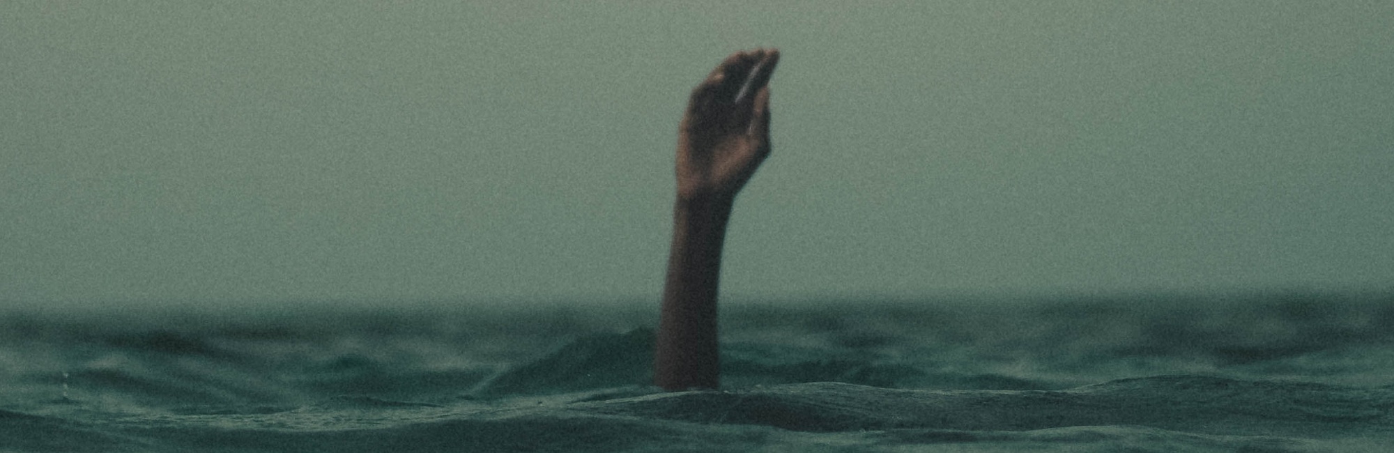 Hand waving for help in sea