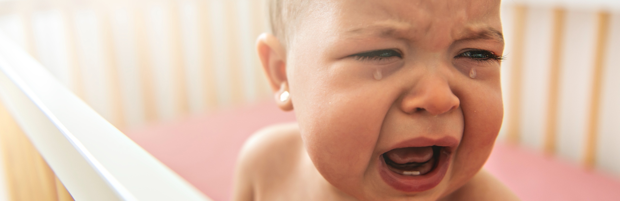 baby crying in cot