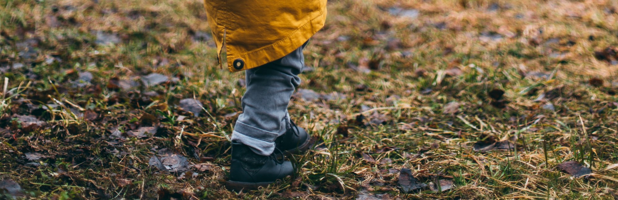 toddler in warm clothes walking outside